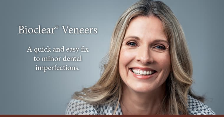 A woman smiling because Bioclear veneers are a cost effective, quick and easy fix to minor dental imperfections. 