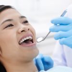 A woman getting get routine dental cleaning in Tacoma, WA