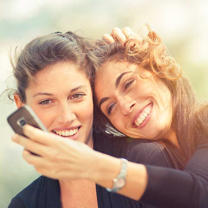 A mom and daughter taking a selfie